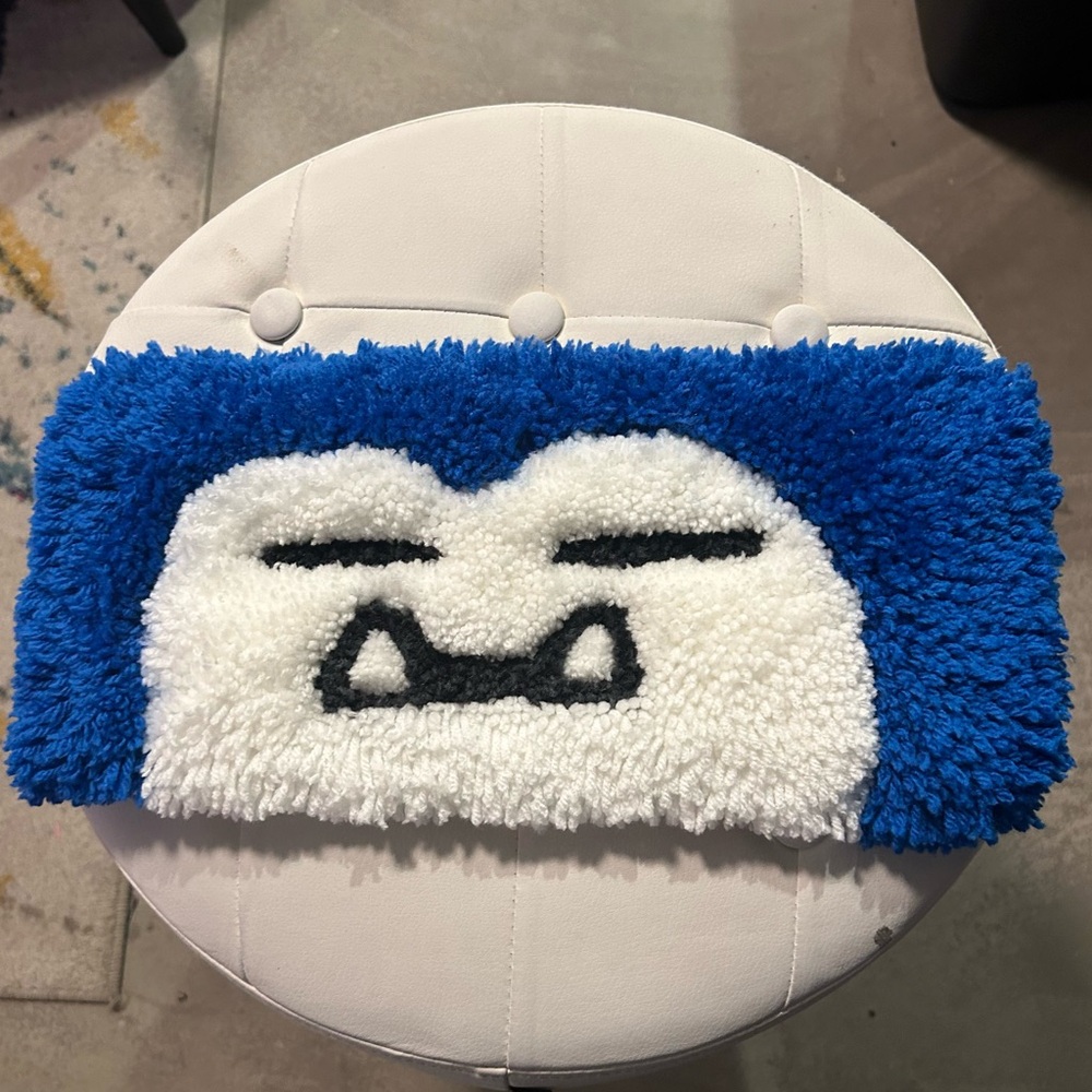 Jumbo sleepy character-inspired 3D keyboard rug